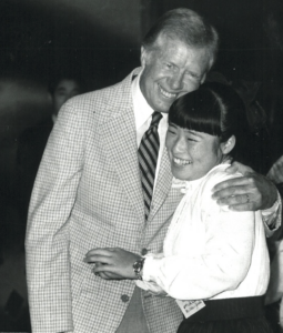 Carter hugging a member from Japan, 1981